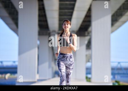 Young Japanese training downtown Stock Photo