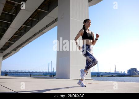 Young Japanese training downtown Stock Photo