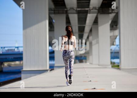 Young Japanese training downtown Stock Photo