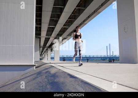 Young Japanese training downtown Stock Photo