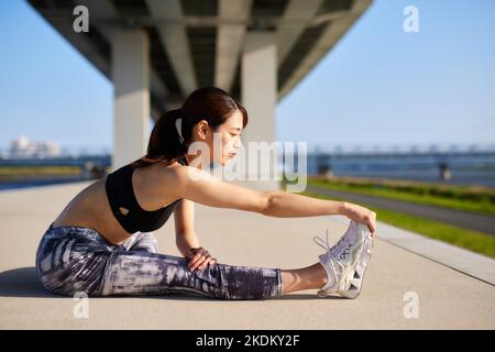 Young Japanese training downtown Stock Photo