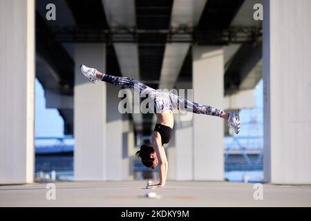Young Japanese training downtown Stock Photo