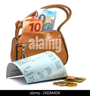 Money bag and receipt symbolic for purchase Stock Photo