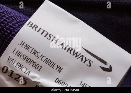 BA British Airways luggage label stuck on luggage for VLC Valencia airport Stock Photo