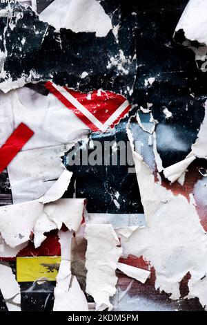 Old grunge torn collage posters creased crumpled paper placard texture background. Ripped faded paper backdrop surface placard Stock Photo