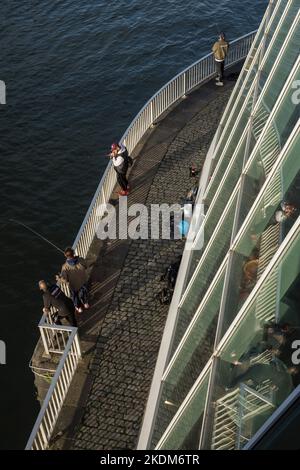 anglers at the Chocolate Museum in Rheinau port, Cologne, Germany. Angler am Schokoladenmuseum im Rheinauhafen, Koeln, Deutschland. Stock Photo