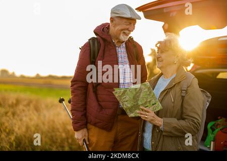 Senior couple looking at map on a road trip Stock Photo