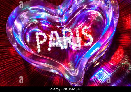 PARIS LOVE FUN NIGHT CONCEPT NIGHTCLUB NIGHTLIFE MONTMARTRE PIGALLE SHOWTIME CABARET CLUB diamonds crystal glass heart with mixed colour lighting in fun clubbing party theatre disco show French concept Paris France Stock Photo