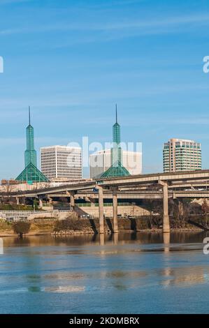 View of the spires of the Oregon Convention Center from across Willamette River in Portland, Oregon.  Kaiser Permanente building is in the background. Stock Photo