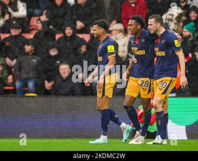 Newcastle United's Joe Willock celebrates with teammates Jacob Murphy and Chris Wood after scoring his sides third goal during the Premier League match at St. Mary's Stadium, Southampton. Picture date: Sunday November 6, 2022. Stock Photo