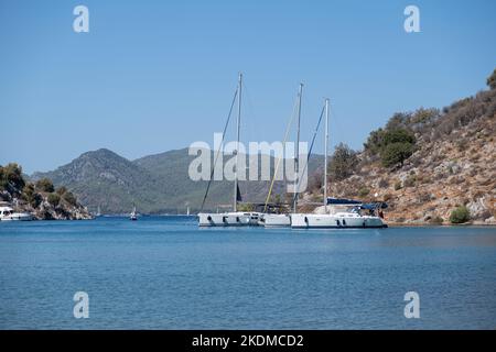 Beautiful bay with sailing boats, yachts in turquoise sea, luxury holidays or sailing regata sports. Stock Photo