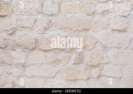 Detailed textured background of sandstone old wall with blocks light yellow colored Stock Photo