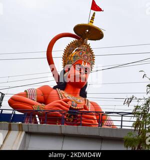 Big statue of Lord Hanuman near the delhi metro bridge situated near Karol Bagh, Delhi, India, Lord Hanuman big statue touching sky Stock Photo