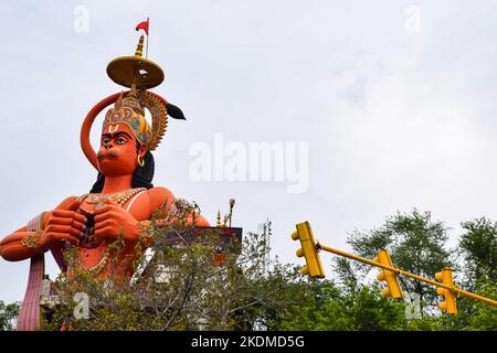 Big statue of Lord Hanuman near the delhi metro bridge situated near Karol Bagh, Delhi, India, Lord Hanuman big statue touching sky Stock Photo