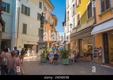 Salo Italy, view in summer of a cafe terrace in Via San Carlo in the center of the scenic Lake Garda town of Salo, Lombardy, Italy Stock Photo