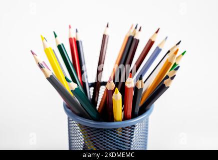 Colored pencils of different colour in metal holder. High quality photo Stock Photo