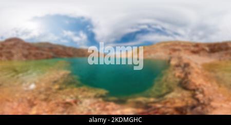Abstract defocused blured background Spherical panorama of emerald lake in a flooded quarry. Emerald green lake in flooded opencast mine. Oval lake in Stock Photo