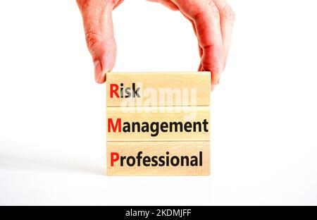 RMP risk management professional symbol. Concept words RMP risk management professional on wooden blocks on a beautiful white background. Business RMP Stock Photo