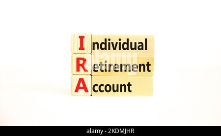 IRA individual retirement account symbol. Concept words IRA individual retirement account on wooden blocks on beautiful white background. Business IRA Stock Photo