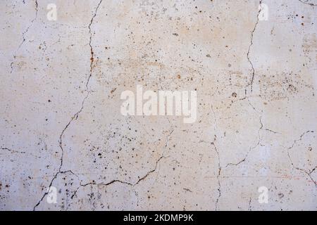 Beige concrete background, cracked wall texture Stock Photo