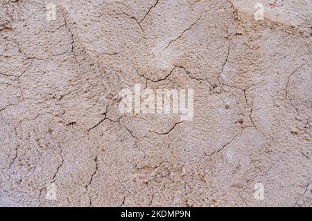 Beige concrete background, cracked wall texture Stock Photo