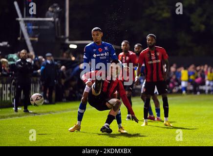 Bracknell Town’s George Knight attempts to clear the ball under pressure from Ipswich Town’s Kayden Jackson during the Emirates FA Cup first round match at the SB Stadium, Sandhurst. Picture date: Monday November 7, 2022. Stock Photo