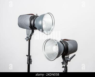 Two studio strobe lights on light stands. Stock Photo