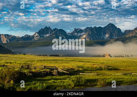 Fog blanets the ground below Idaho's Sawtooth Mountains. Stock Photo