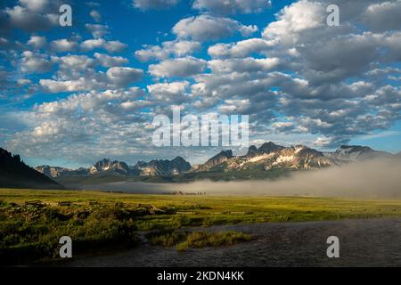 Fog blanets the ground below Idaho's Sawtooth Mountains. Stock Photo