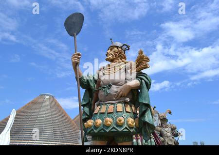 Statue of Fornaro - baker standing in a group of statues of The Food People by Dante Ferretti at the Expo Milano 2015. Stock Photo