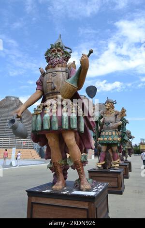 Statue of Enolo winemaker standing in a group of statues of The Food People by Dante Ferretti at the Expo Milano 2015. Stock Photo