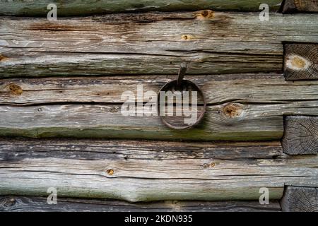 An old wooden wall made out of logs in rural Estonia Stock Photo