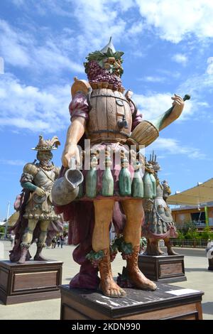Milan, Italy - August 21, 2015: Statue of Enolo winemaker standing in a group of statues of The Food People by Dante Ferretti at the Expo Milano 2015. Stock Photo