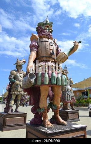 Statue of Enolo winemaker standing in a group of statues of The Food People by Dante Ferretti at the Expo Milano 2015. Stock Photo
