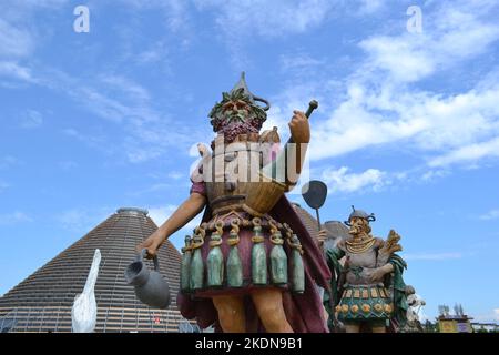 Statue of Enolo winemaker standing in a group of statues of The Food People by Dante Ferretti at the Expo Milano 2015. Stock Photo