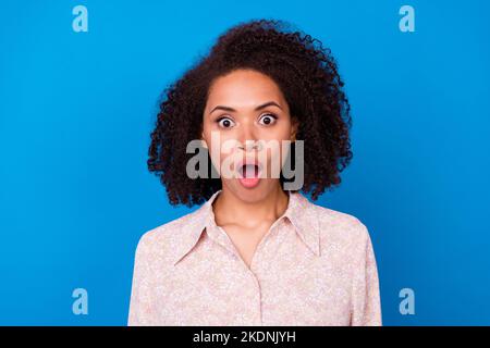 Portrait of impressed speechless person open mouth unbelievable isolated on blue color background Stock Photo