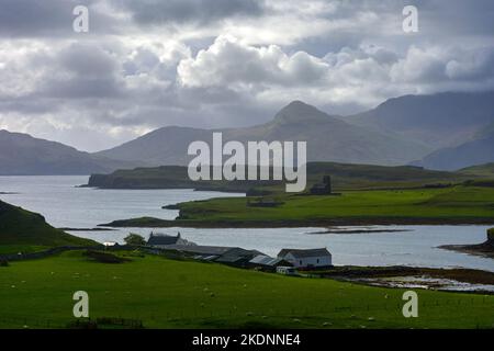 Bloodstone Hill on the Isle of Rum, looking over the island of Sanday from the Isle of Canna, Scotland, UK