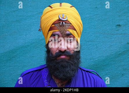 Mumbai, India. 07th Nov, 2022. Nihang or Sikh warrior poses for a photo ahead of the birthday celebration of Guru Nanak Dev Ji in Mumbai. Gatka is a Punjabi word that translates to wooden sticks, which are used instead of swords. it uses a sword as the main weapon, amongst others. person's spiritual and physical aspect is developed during the learning phase of this ancient art. Gatka was extensively used by Sikh warriors to defend themselves from the atrocities of the Mughals and the British rulers. Credit: SOPA Images Limited/Alamy Live News Stock Photo