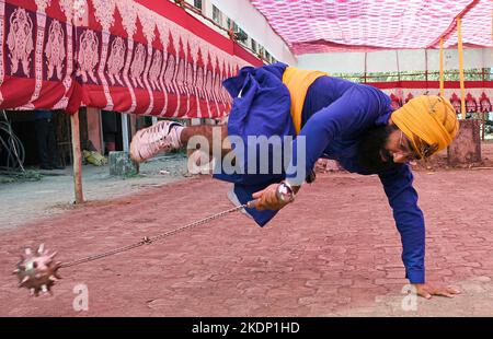 Mumbai, India. 07th Nov, 2022. Nihang or Sikh warrior performs Gatka (a form of martial art) using a spike wrecking ball ahead of the birthday celebration of Guru Nanak Dev Ji in Mumbai. Gatka is a Punjabi word that translates to wooden sticks, which are used instead of swords. it uses a sword as the main weapon, amongst others. person's spiritual and physical aspect is developed during the learning phase of this ancient art. Gatka was extensively used by Sikh warriors to defend themselves from the atrocities of the Mughals and the British rulers. Credit: SOPA Images Limited/Alamy Live News Stock Photo