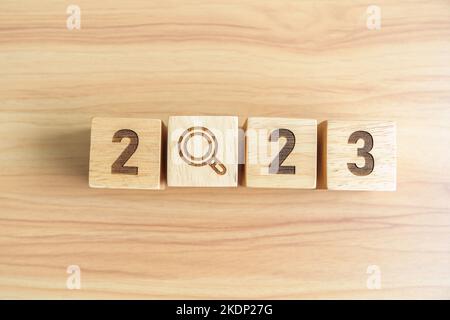 2023 block with magnifying glass icon. SEO, Search Engine Optimization, hiring , Advertising, Idea, Strategy, marketing, Keyword, Content and New Year Stock Photo