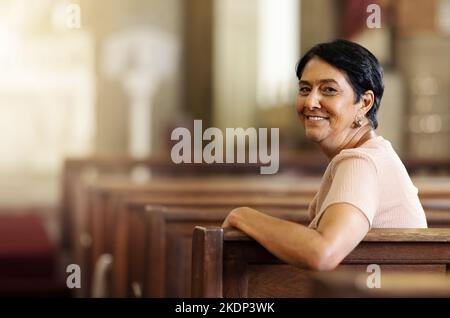 Senior woman, christian and happy in church, spiritual and religion after service, smile and lifestyle. Elderly female smile, portrait and empowerment Stock Photo