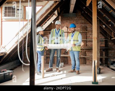 Blueprint, planning and architect team meeting for construction, building and industrial house project. Teamwork, collaboration and employees talking Stock Photo