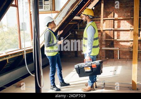 Construction, teamwork and planning with an engineer and designer working together on a building site. Meeting, strategy and engineering with a Stock Photo