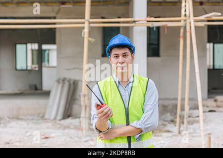 portrait Asian male builder worker foreman engineer at construction site home building project Stock Photo