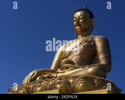 Closeup view of the big Dordenma Buddha statue representing Shakyamuni in lotus position with alms bowl above Thimphu, Bhutan Stock Photo