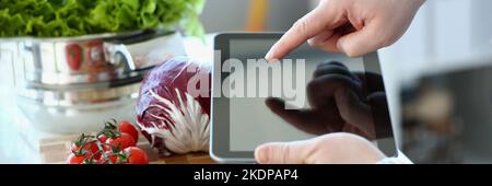 Vlogger chef showing ripe vegetables ingredients, video for culinary vlog Stock Photo