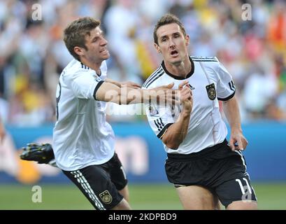 File photo dated 27-06-2010 of Germany's Miroslav Klose (right) celebrates with his team mate Thomas Muller (left) after scoring the opening goal. The World Cup starts in Qatar in a little under two weeks’ time and here, the PA news agency takes a look at the tournament in numbers. 16 - former Germany striker Miroslav Klose is the World Cup's all-time record goalscorer. Compatriot Thomas Muller is the leading active player, on 10. Issue date: Tuesday November 8, 2022. Stock Photo