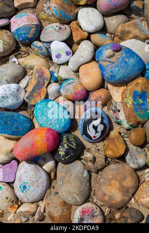 Avon Beach pebbles - painted pebbles on Avon Beach, Mudeford, Christchurch, Dorset UK in June Stock Photo