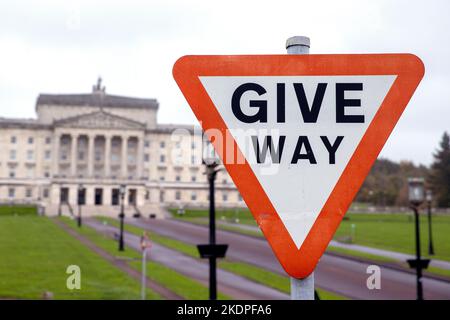 Stock image of a give way traffic sign in front of Parliament Buildings at Stormont Estate, in Northern Ireland. Stock Photo