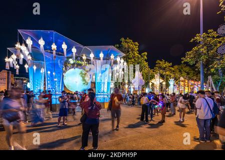 Chiang Mai, Thailand - 7 November 2022 - Tourists enjoy their time checking out the beautiful elaborate hanging lanterns at Tha Pae Gate area Stock Photo